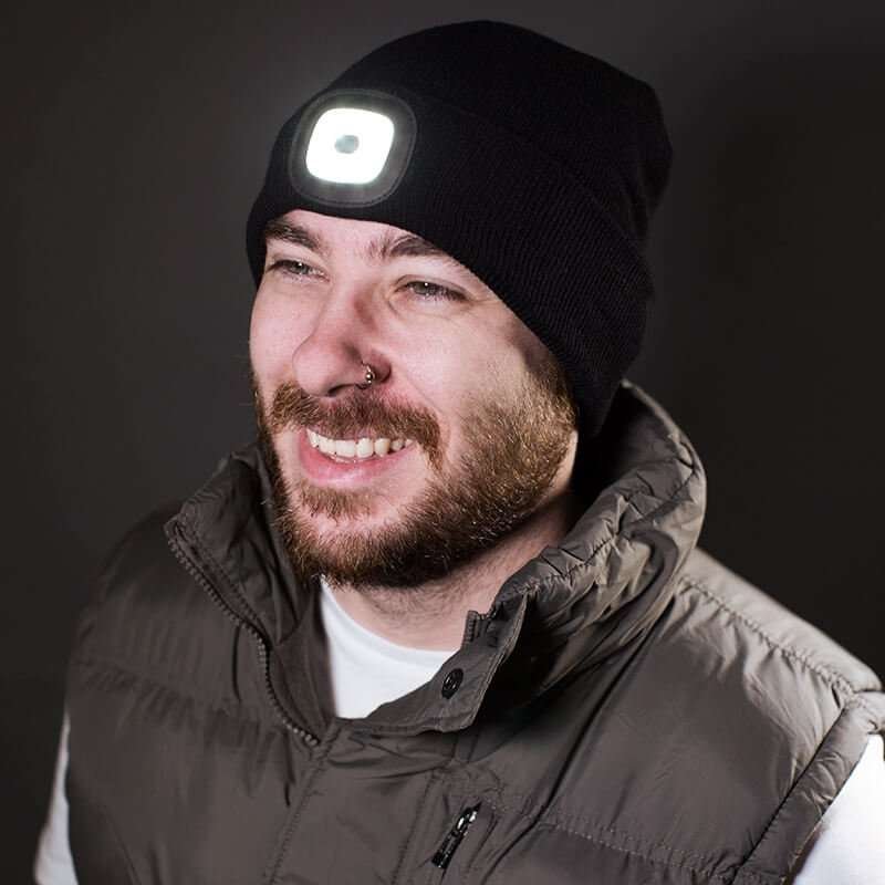 Man wearing a beanie with a light