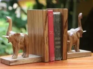 Bookends made from wood in the shape of two elephants
