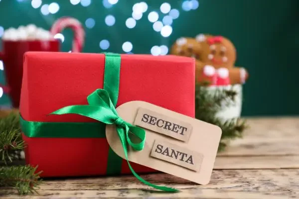A gift with a tag that says "Secret Santa"