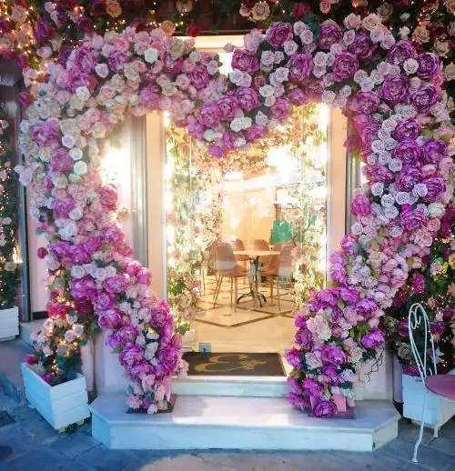 A pink bow heart made from roses