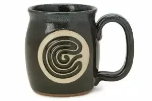A mug with a finger tracing pattern