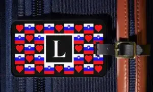 A personalized luggage tag with the flag of Slovenia in hearts