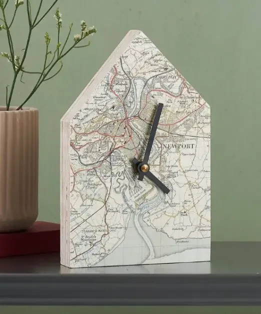 Clock in shape of a home