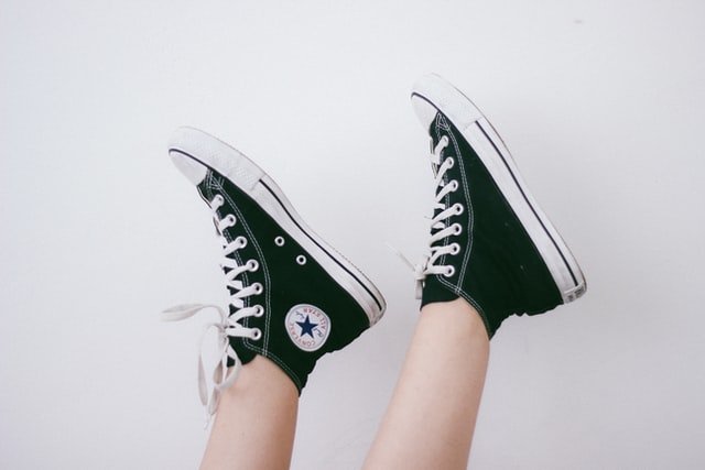 Two feet with converse shoes
