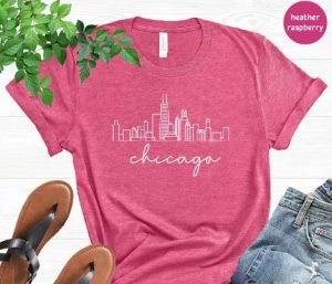 A pink t-shirt with the skyline of Chicago