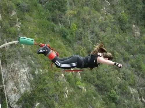 Woman bungee jumping
