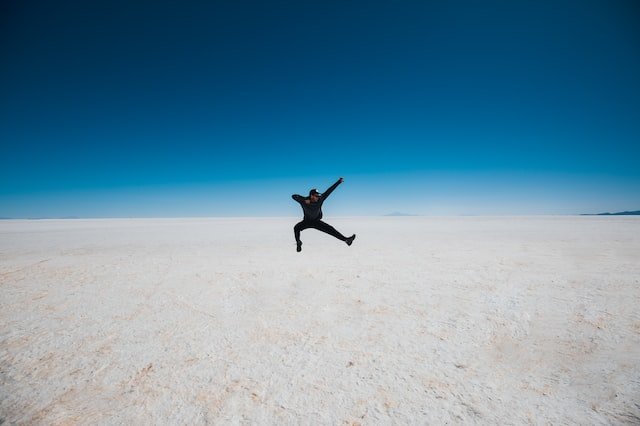 A man jumping the salt lakes in Bolivia