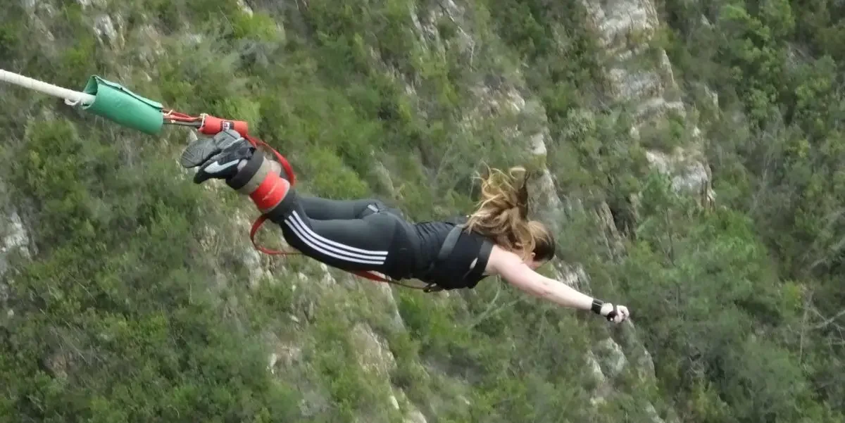 Woman bungee jumpinging