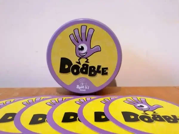 Package and cards of the game "Dobble or Spot It"