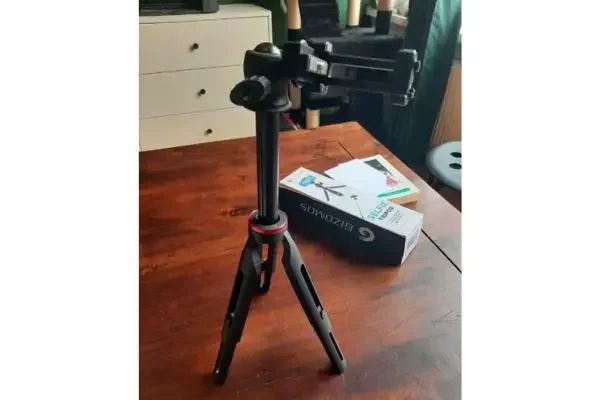 A tripod and selfie stick for a phone