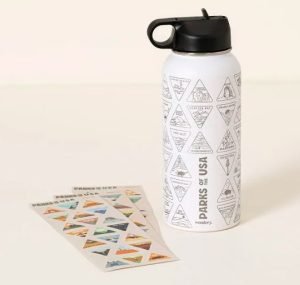 A water bottle with stickers for different US national parks
