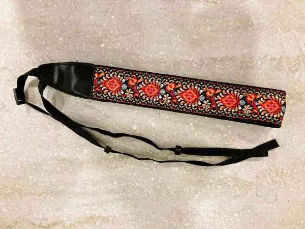 An embroidered camera strap