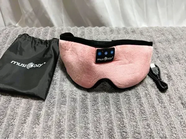 A sleeping mask with a built-in headphones