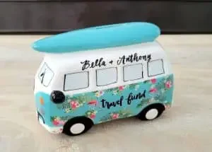 A small piggy bank in the shape of a hippie van