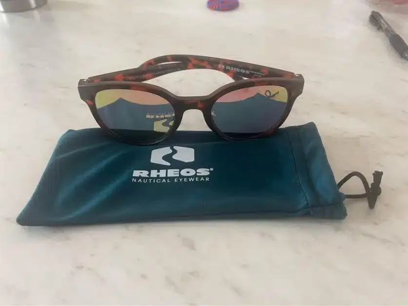 A pair of sunglasses from the brand Rheos