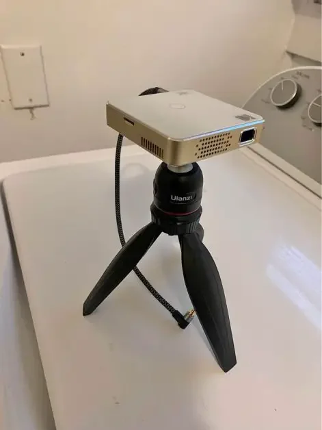 A mini projector on a tripod