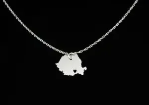 A silver necklace with a pendant in the shape of the map of Romaniac