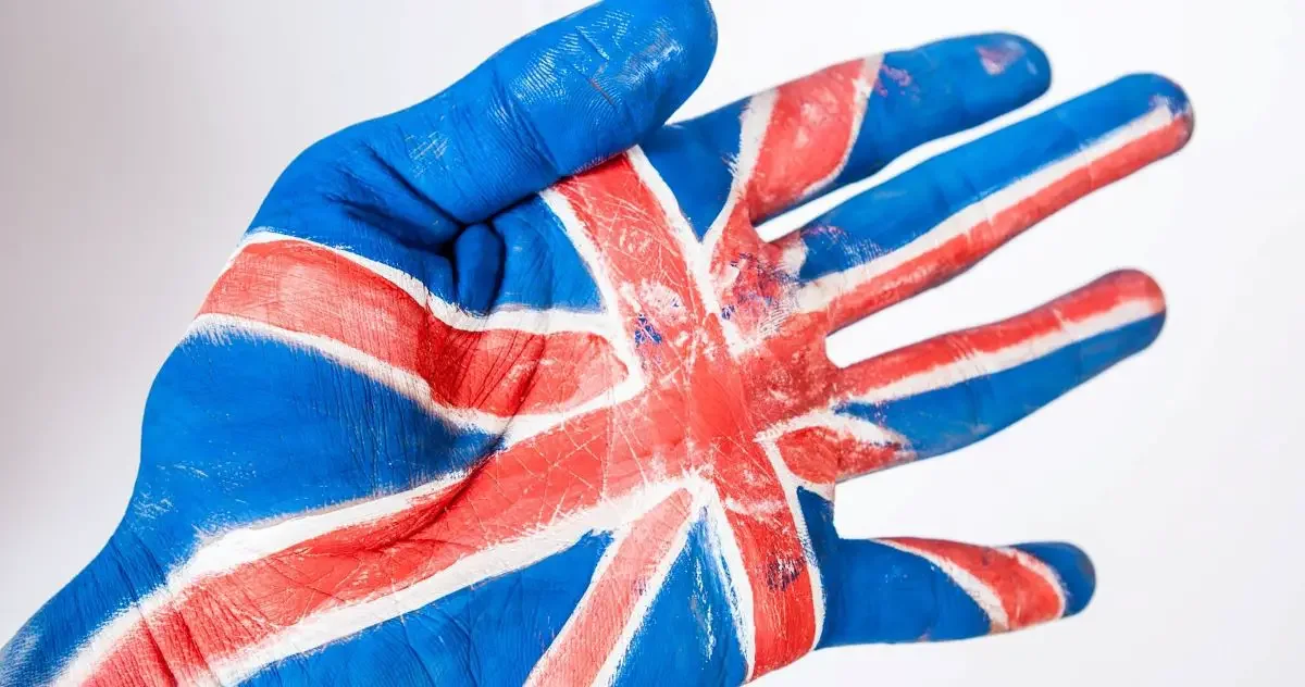 Hand with the Union Jack flag