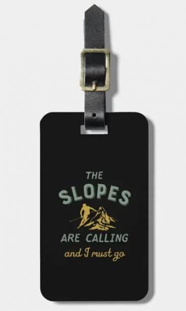 Luggage tag with text: the slopes are calling and I must go