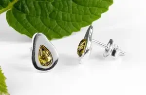 two silver earring studs that look like avocados