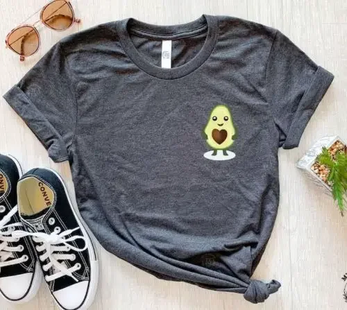 A grey t-shirt with a small avocado on the chest