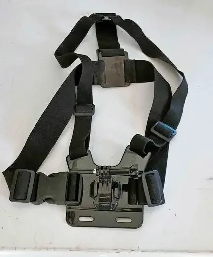 A black chest harness to hold a Go Pro