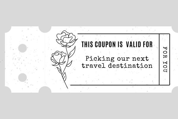 A white selfmade coupon for "picking our next travel destination"