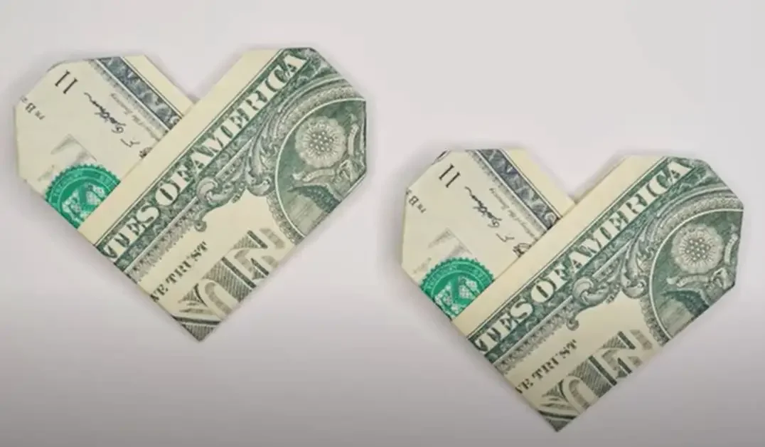 Two hearts folded from cash