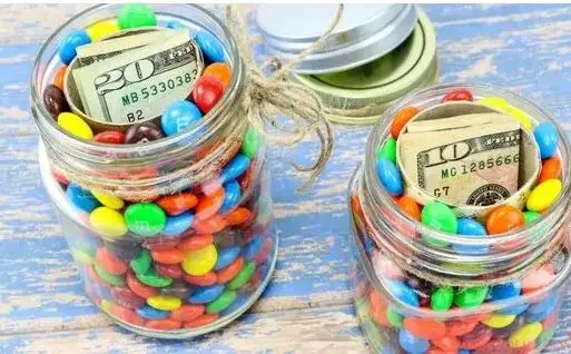 Jar filled with candy and money