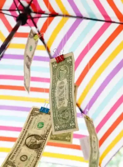 Umbrella with cash hanging inside