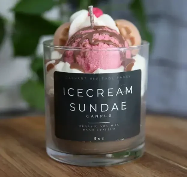 A candle in the shape of an ice cream sundae