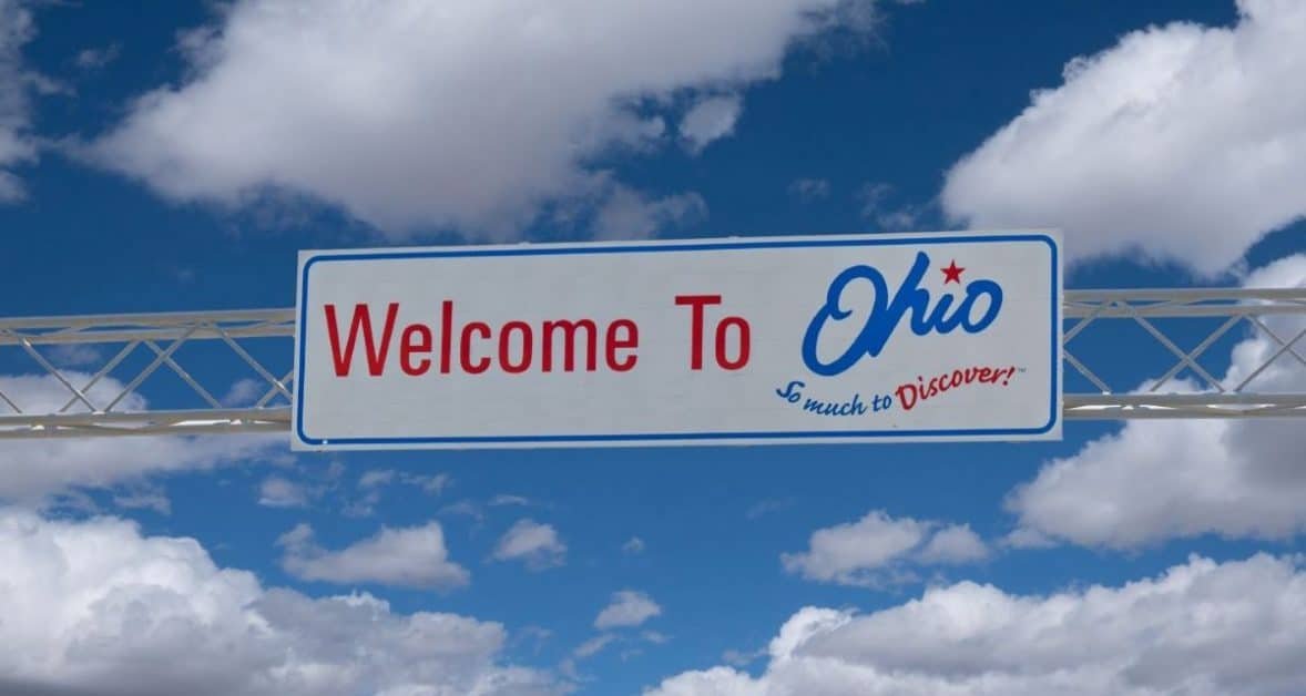 Road sign with "welcome to Ohio, so much to discover"