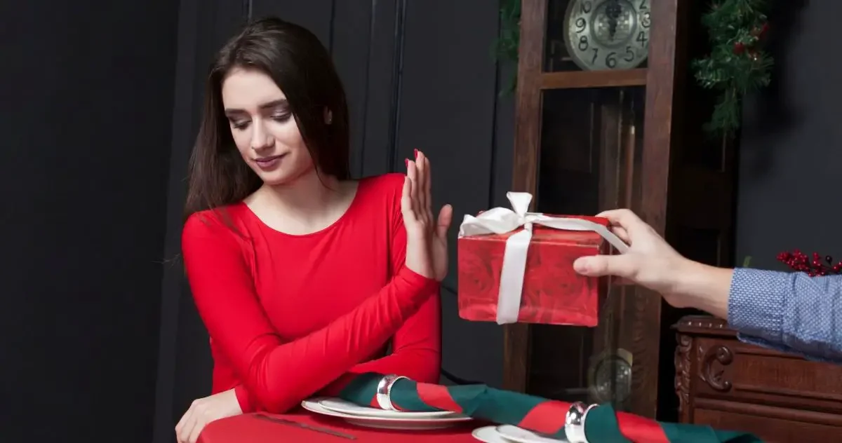 Woman refusing a gift