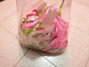 Bag of used ribbons and strings to reuse as a sustainable gift wrap