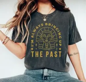 A woman wearing a shirt with a funny history-related text