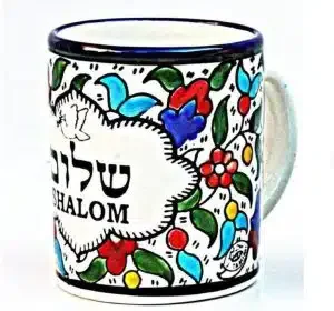 A colorful mug with "Shalom"