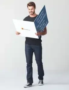 Man holding an enormous graduation card with a funny graduation message