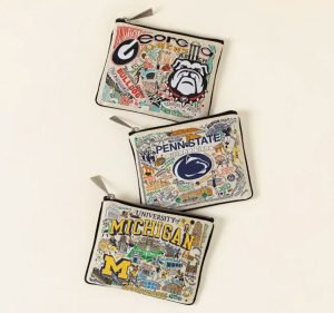 Three coin pouches in the theme of three American colleges