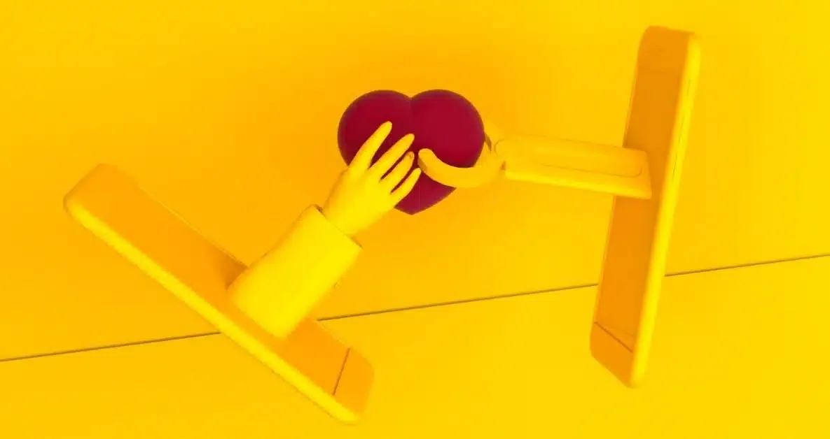Two icons of yellow cell phones that are holding a red heart in the middle