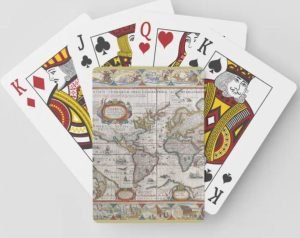 A deck of cards with a print of a vintage world map