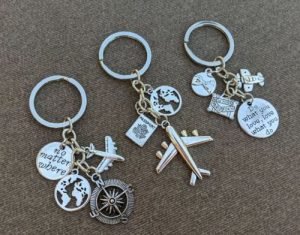 Three keychains with pendants of the globe