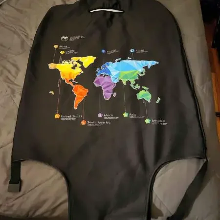 A black suitcase cover with a world map