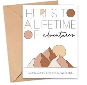 card for newlyweds with "Here is to a lifetime of adventures. Congrats on your wedding." 