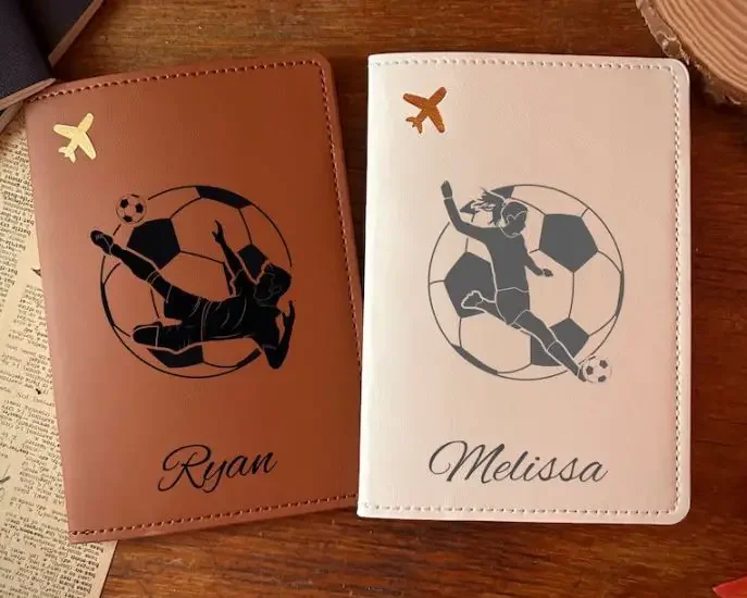 two leather passport cover with a name and a soccer ball and player