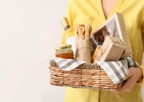Woman holding a basket with food and rustic colors
