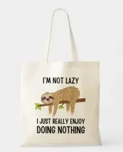 A tote bag with a sloth and "I'm not laxy, I jusy really enjoy doing nothing"