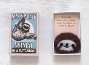 A match box with a felt sloth an the text "my spirit animal in a matchbox"