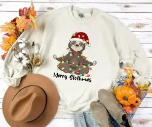A sweatshirt with a sloth and "Merry Slothmas"