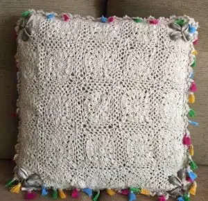 A crochet cushion made from white cotton in Ibiza