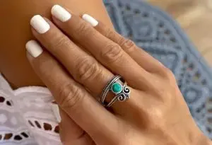 A hand with a handmade ring from Ibiza